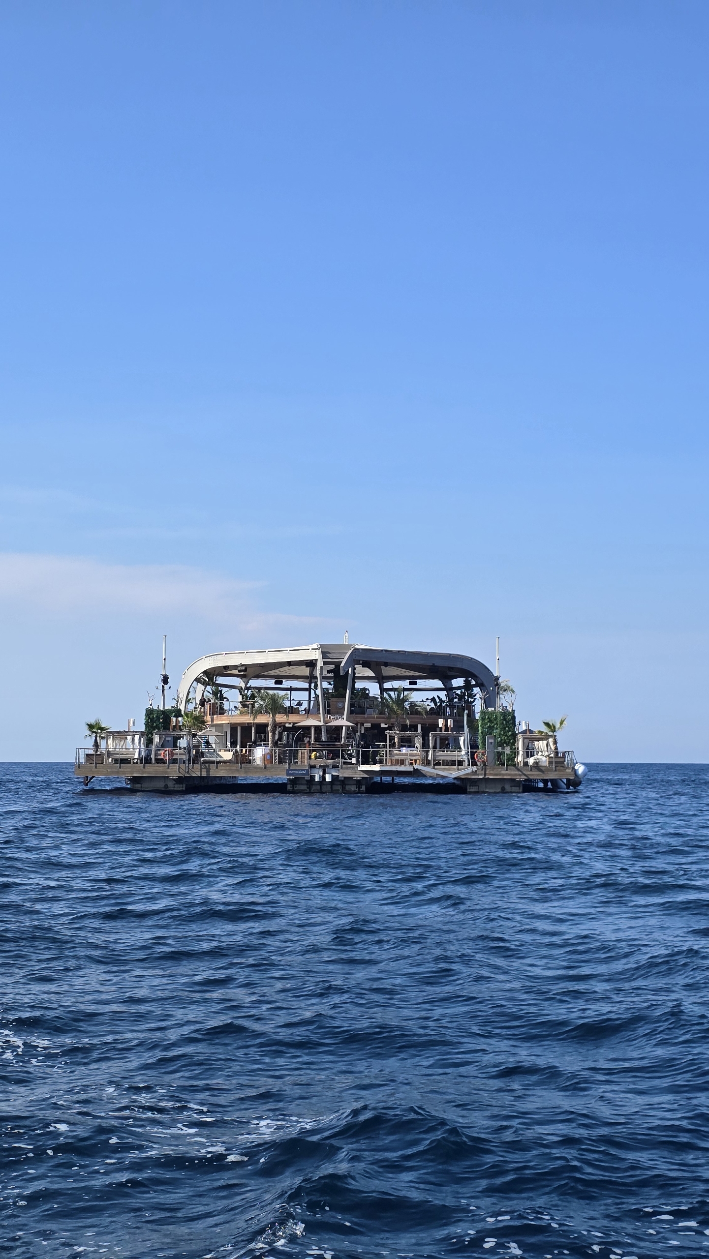 Floating beach club platform at sea