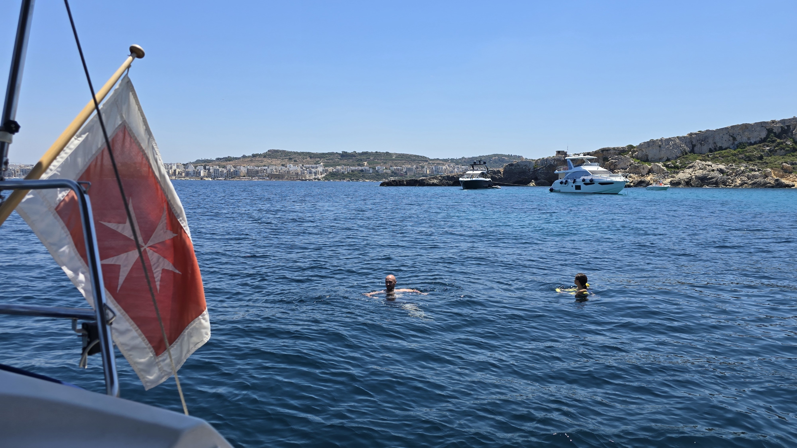 Swimming near Comino with the flag flying